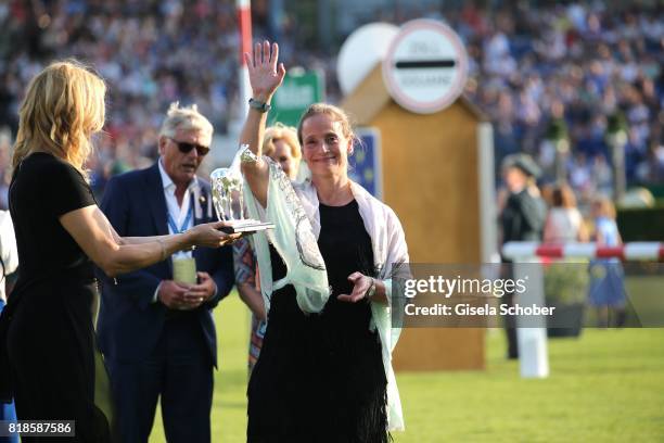 Veronica Ferres gives the award "silver horse" to Isabell Werth during the media night of the CHIO 2017 on July 18, 2017 in Aachen, Germany.