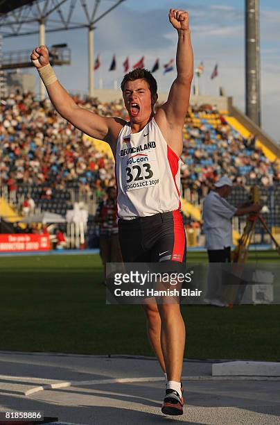 David Storl of Germany celebrates winning the men's shot put during day one of the 12th IAAF World Junior Championships at the Zawisca Stadium on...