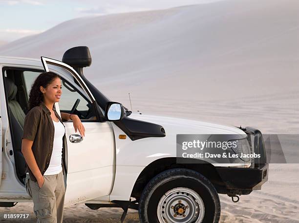 mixed race woman leaning on truck door - car isolated doors open stock pictures, royalty-free photos & images