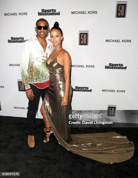 Player Orlando Scandrick and model Draya Michele attend Sports Illustrated Fashionable 50 at Avenue on July 18, 2017 in Los Angeles, California.