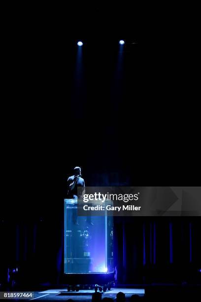 David Blaine pre-breathes pure oxygen on stage before holding his breath underwater for over ten minutes at ACL Live on July 18, 2017 in Austin,...