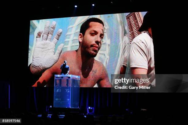 David Blaine pre-breathes pure oxygen on stage before holding his breath underwater for over ten minutes at ACL Live on July 18, 2017 in Austin,...