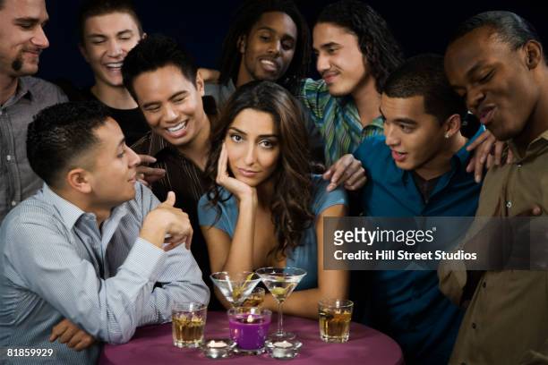 multi-ethnic men talking to bored woman - adulation ストックフォトと画像