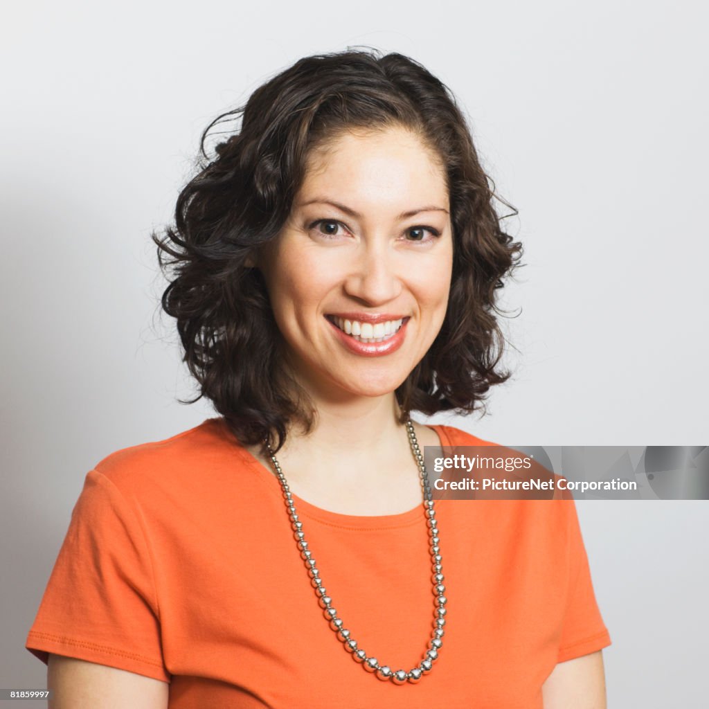 Hispanic woman wearing necklace