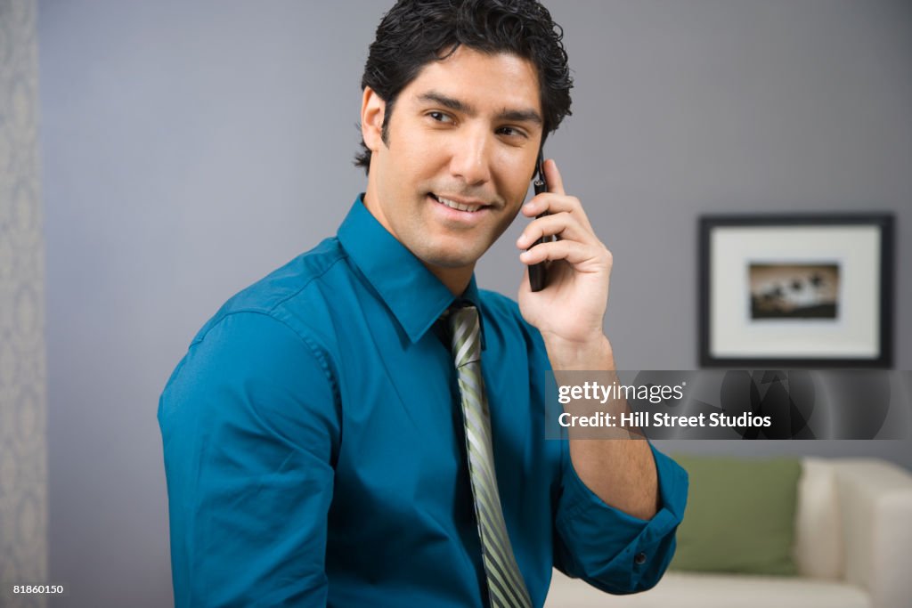 Hispanic businessman talking on cell phone
