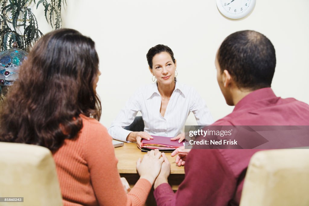 Mixed Race businesswoman talking to clients