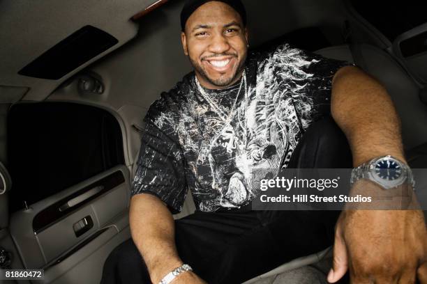 african man sitting in limousine - fabolous rapper stock pictures, royalty-free photos & images
