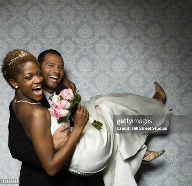 multi-ethnic newlyweds laughing - wedding couple laughing photos et images de collection