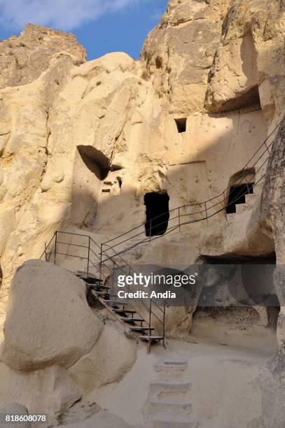 Turkey. Goreme Open-Air Museum with churches carved out from stone and troglodyte dwellings. Tourists on visit.