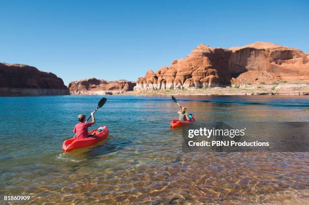 people kayaking in lake - lake powell stock pictures, royalty-free photos & images