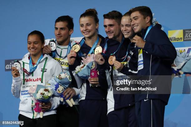 Gold medalists Laura Marino and Mattieu Rosset of France pose with the medals won during the Mixed Diving Team final on day five of the Budapest 2017...
