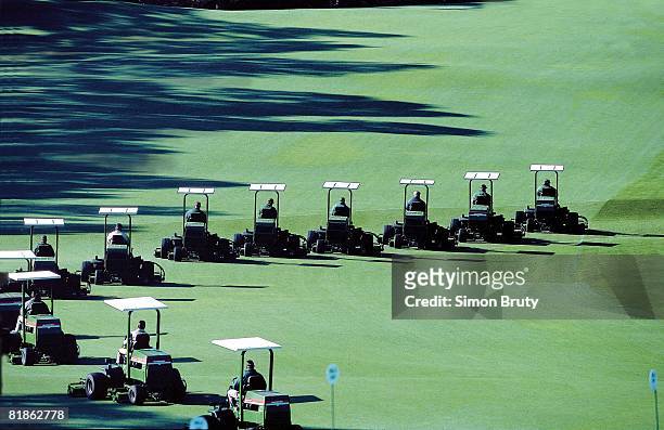 Golf: Groundskeepers riding lawn mowers, equipment before The Masters at Augusta National, Augusta, GA 4/4/2000