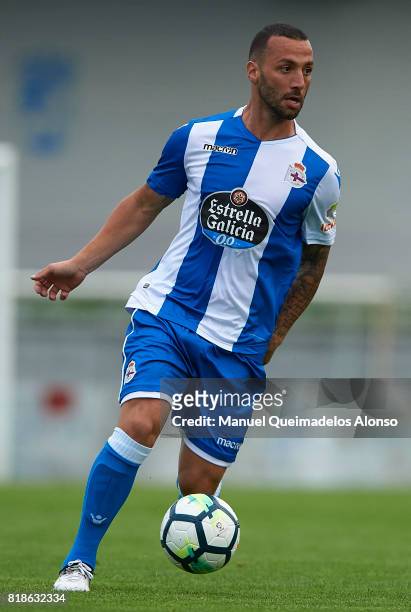 Guilherme dos Santos of Deportivo de La Coruna runs with the ball during the pre-season friendly match between Cerceda and Deportivo de La Coruna at...