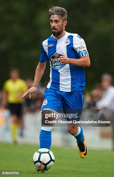 Luisinho Correia of Deportivo de La Coruna runs with the ball during the pre-season friendly match between Cerceda and Deportivo de La Coruna at O...