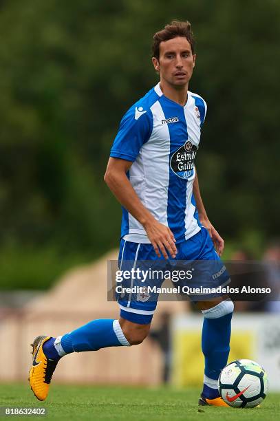 Pedro Mosquera of Deportivo de La Coruna runs with the ball during the pre-season friendly match between Cerceda and Deportivo de La Coruna at O Roxo...