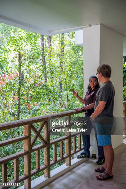 Naturalist Shakira Mobarak pointing to a colugo, or flying lemur, to a guest at the Andaman, a Luxury Collection Resort on Datai Bay on the Malaysian...