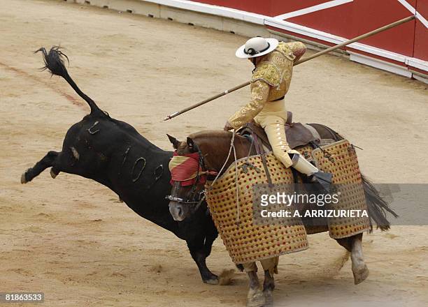 Cebada Gago bull figths against a "Picador" horse during the second corrida of the San Fermin festivities, on July 8 in Pamplona, northern Spain. AFP...