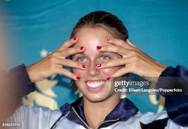 Year-old swimmer Amanda Beard of the USA with "Go USA" on her fingernails during the Summer Olympic Games in Atlanta, circa July 1996. She became the...