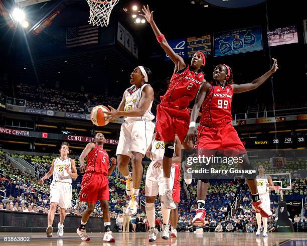 Cappie Pondexter of the Phoenix Mercury shoots against Michelle Snow of the Houston Comets on July 8, 2008 at U.S. Airways Center in Phoenix,...