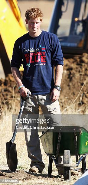 Prince Harry helps rebuild a school on July 8, 2008 in Buthe Buthe, Lesotho. Prince Harry and 26 soldiers from the Household Cavalry are in Lesotho...