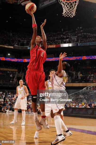 Michelle Snow of the Houston Comets shoots against Le'coe Willingham of the Phoenix Mercury on July 8 at U.S. Airways Center in Phoenix, Arizona....