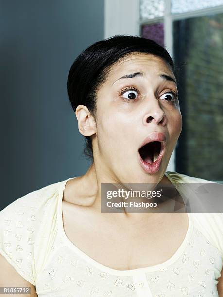 portrait of woman looking shocked and surprised - shock stock pictures, royalty-free photos & images
