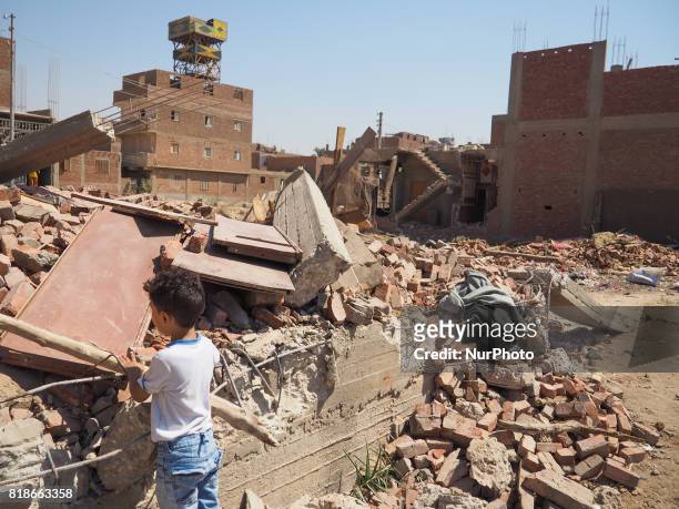 An Egyptian children looks a destroyed house in al-Warraq Island, Giza, Egypt, 18 July 2017. Clashes broke at the island of al-Warraq after security...