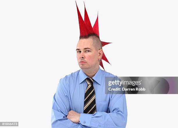 businessman with red spiked hair, arms folded - coiffure punk stock-fotos und bilder