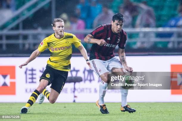 Milan Defender Gustavo Gomez plays against Borussia Dortmund Midfielder Andre Schurrle in action during the International Champions Cup 2017 match...