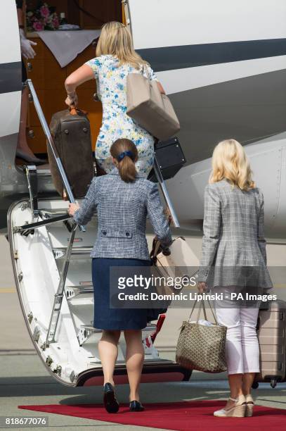 Stylist to the Duchess of Cambridge Natasha Archer, Nanny Maria Borrallo and Hairdresser Amanda Cook Tucker depart from Chopin airport, in Warsaw, on...