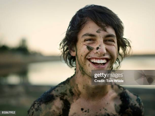 portrait of a man covered in mud - people covered in mud stock pictures, royalty-free photos & images