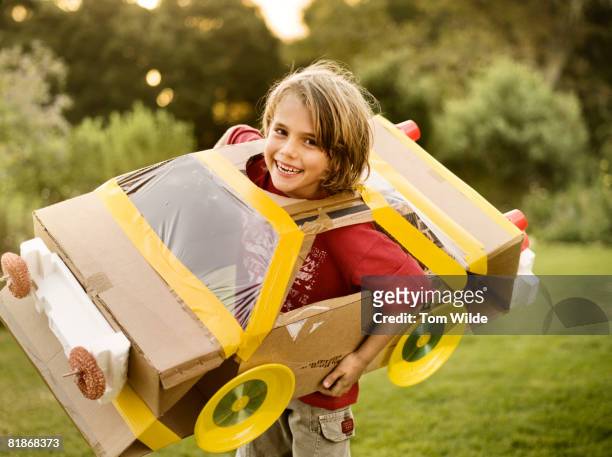 boy with home made cardboard car - boy kid playing cars stock pictures, royalty-free photos & images