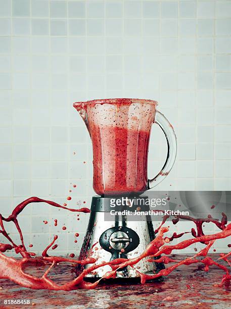 blender making a smoothie explodes its contents into the air - blender foto e immagini stock