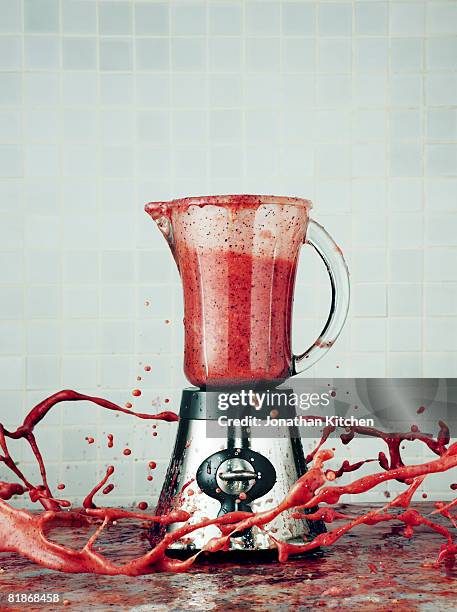 blender making a smoothie explodes its contents into the air - blended drink ストックフォトと画像