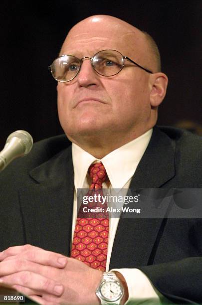 Deputy Secretary of State nominee Richard Lee Armitage listens to opening statements March 15, 2001 during Senate Foreign Relations Committee...