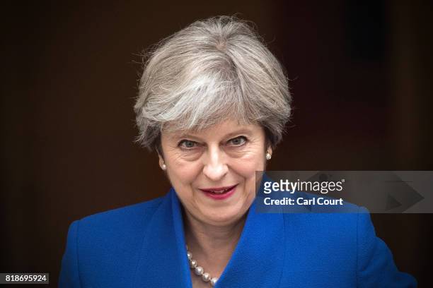 Britain's Prime Minister, Theresa May, leaves for the weekly Prime Minister's Questions at the House of Commons on July 19, 2017 in London, England....