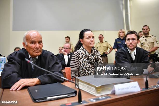 Beate Zschaepe, the main defendant in the marathon NSU neo-Nazi murder trial, and her lawyers Mathias Grasel and Hermann Borchert arrive in court on...