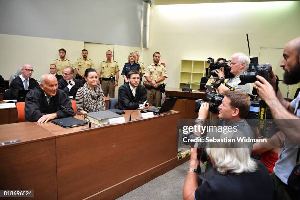 Beate Zschaepe, the main defendant in the marathon NSU neo-Nazi murder trial, and her lawyers Mathias Grasel and Hermann Borchert arrive in court on...