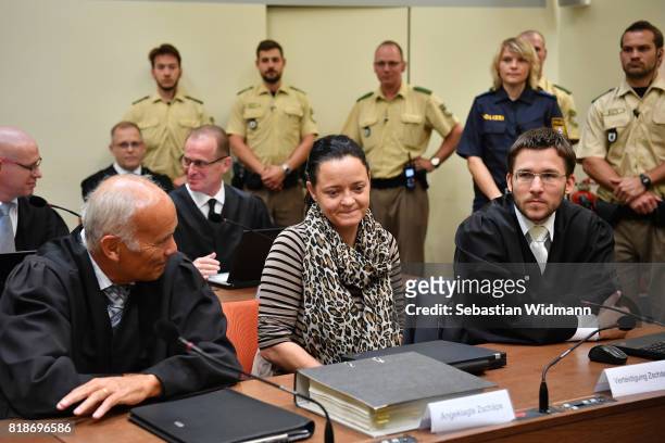 Beate Zschaepe, the main defendant in the marathon NSU neo-Nazi murder trial, and her lawyers Mathias Grasel and Hermann Borchert arrive in court on...