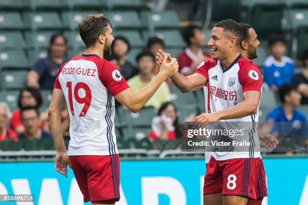 West Bromwich Albion forward Jay Rodriguez celebrates with teammate Jake Livermore during the Premier League Asia Trophy match between Leicester City...