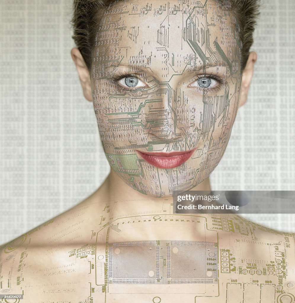 Woman with computer circuit board lines on face