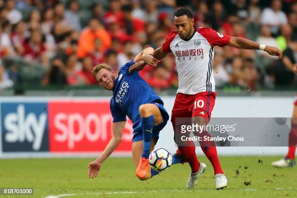 Callum Elder of Leiceister City tackles Matt Phillips of West Bromwich Albion during the Premier League Asia Trophy match between Leicester City and...