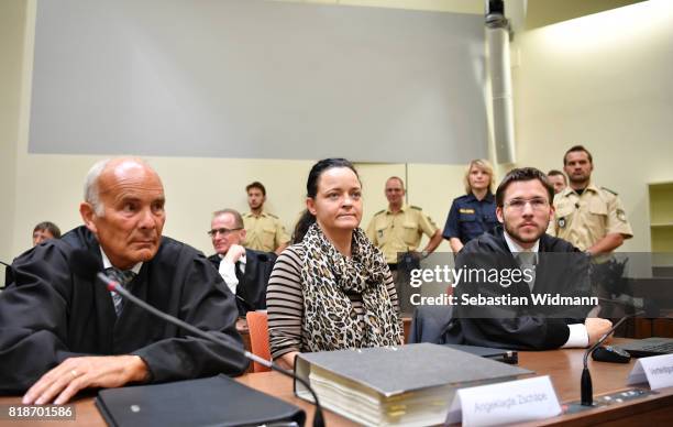 Beate Zschaepe, the main defendant in the marathon NSU neo-Nazi murder trial, and her lawyers Mathias Grasel and Hermann Borchert arrive in court on...