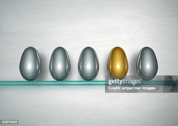 1 golden egg between 5 silver eggs - empty shelf stock illustrations