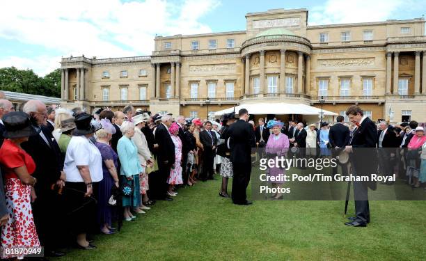 Queen Elizabeth II meets guests as she hosts a garden party in the grounds of Buckingham Palace on July 8, 2008 in London, England.