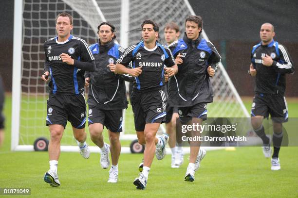 Chelsea players including John Terry and Tal Ben-Haim jog during a training session, July 9, 2008 in Cobham, England