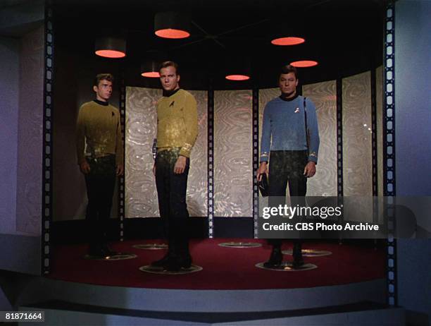 From left, American actor Bruce Watson as Crewman Green, Canadian actor William Shatner as Captain James T. Kirk, and American actor DeForest Kelley...