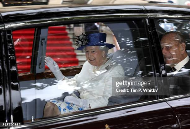 Queen Elizabeth II and Price Philip, Duke of Edinburgh depart after a visit to Canada House on July 19, 2017 in London, England. The visit is to...