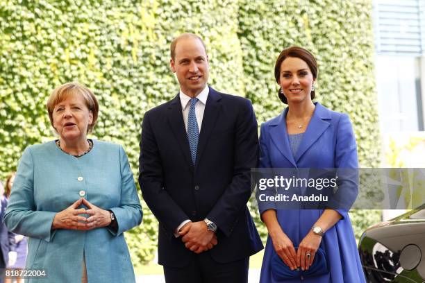 German Chancellor Angela Merkel welcomes Duke of Cambridge Prince William and Duchess of Cambridge Catherine in the German Chancellory during their...