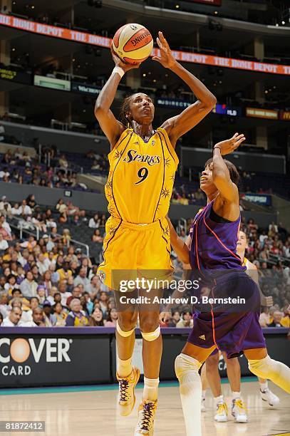 Lisa Leslie of the Los Angeles Sparks lays up a shot around Tangela Smith of the Phoenix Mercury during the WNBA game on July 6, 2008 at Staples...